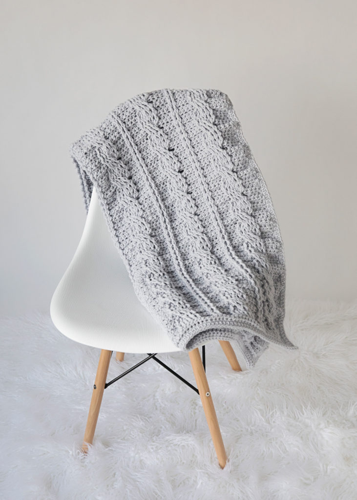 3. Crochet Cabled Patterned Throw Pillow